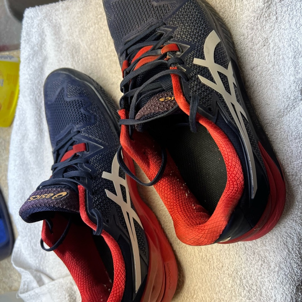 ASIC Gel Resolution 8 tennis shoes.